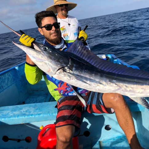 A man stands on the edge of the Todos Santos cliffs.